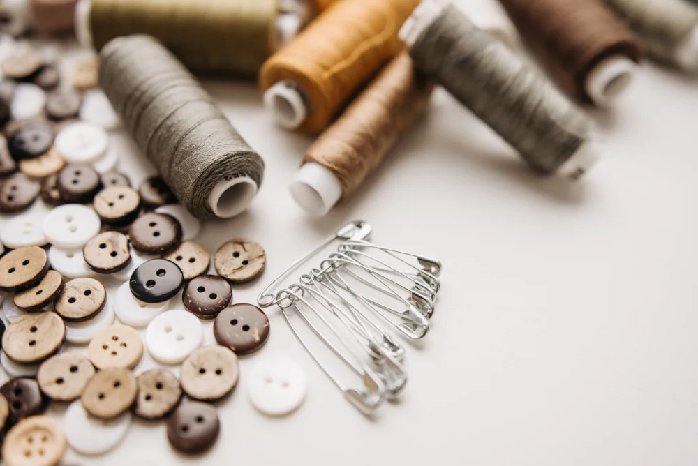 sewing supplies threads, buttons and safety pins